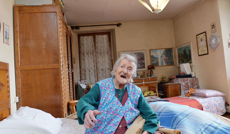 Emma Morano sits on her bed in her apartment in Verbania, Italy, Friday, May 13, 2016. Emma Morano is now the oldest person in the world. Not only that, but she is believed to be the last surviving person in the world who was born in the 1800s, coming into the world on Nov. 29, 1899. That’s just 4 and a half months after Susannah Mushatt Jones, who died Thursday in New York at the age of 116. (Antonino Di Marco/ANSA via AP)