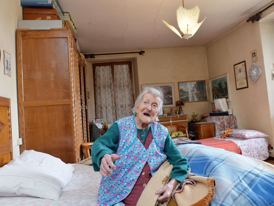 Emma Morano sits on her bed in her apartment in Verbania, Italy, Friday, May 13, 2016. Emma Morano is now the oldest person in the world. Not only that, but she is believed to be the last surviving person in the world who was born in the 1800s, coming into the world on Nov. 29, 1899. That’s just 4 and a half months after Susannah Mushatt Jones, who died Thursday in New York at the age of 116. (Antonino Di Marco/ANSA via AP)