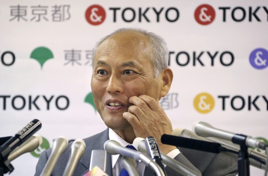 Tokyo Gov. Yoichi Masuzoe answers reporters questions during a press conference in Tokyo, Friday, May 13, 2016. The governor Tokyo has triggered public outrage for flying first-class and staying at up to $1,800-a-night suites in Europe and America during official overseas trips. (AP Photo/Koji Sasahara)