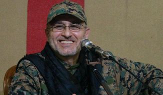 This undated handout image released on Friday, May 13, 2016, by Hezbollah Media Department, shows slain top military commander Mustafa Badreddine smiling during a meeting. Lebanon&#39;s militant Hezbollah group said its top military commander Mustafa Badreddine was killed in Syria. (Hezbollah Media Department via AP)