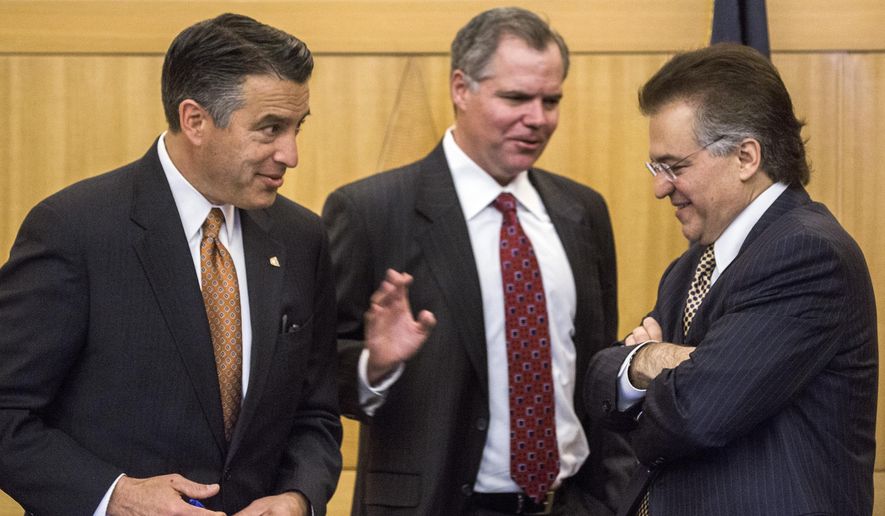 Nevada Gov. Brian Sandoval, from left, Bill Murren, CEO of MGM Resorts International, and Tony Alamo, chairman of Nevada Gaming Commission, talk during the Gaming Policy Committee meeting to discuss "esports" in Las Vegas on Friday, May 13, 2016. (Jeff Scheid/Las Vegas Review-Journal via AP) MANDATORY CREDIT
