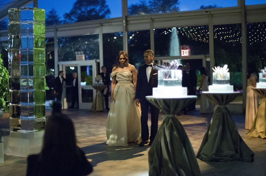 President Barack Obama and first lady Michelle Obama walk in as they are introduced during a state dinner for Nordic Leaders on the South Lawn of the White House in Washington. (AP Photo/Pablo Martinez Monsivais)