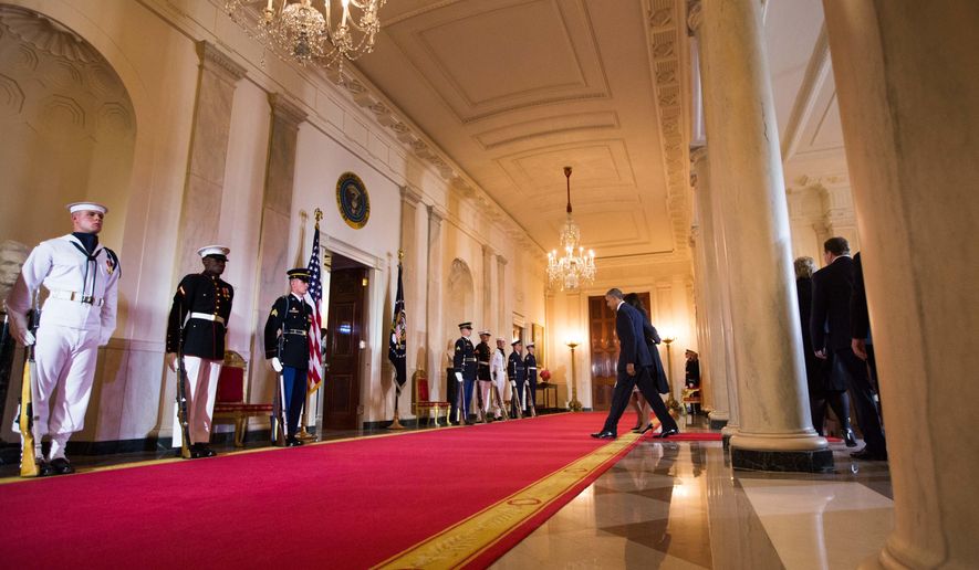 President Barack Obama leaves the Grand Foyer of the White House in Washington, Friday, May 13, 2016, following the arrival ceremony for the Nordic summit. Nordic leaders are at the White house for a U.S.-Nordic Summit on security and economic issues followed by a State Dinner. (AP Photo/Andrew Harnik)