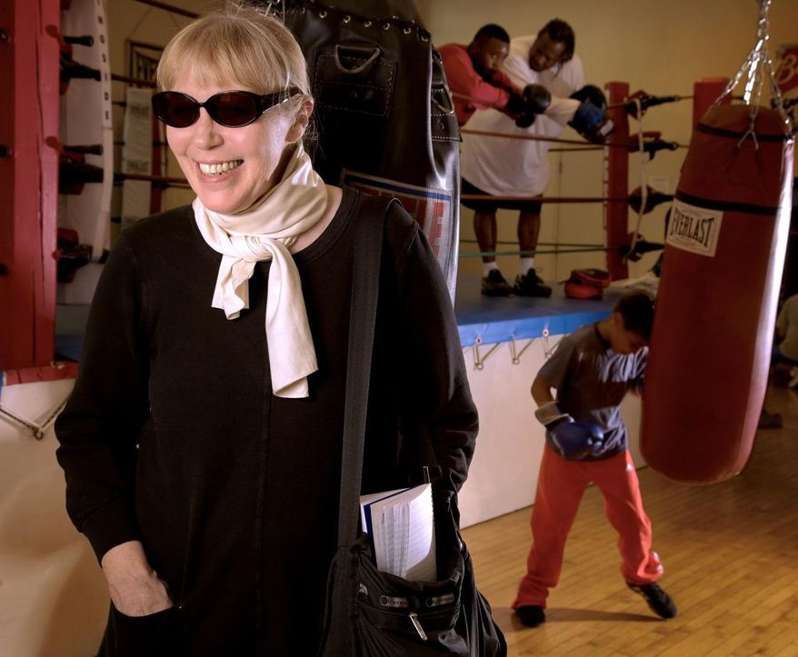 In this 2009 photo, journalist and author, Katherine Dunn, makes a visit to one of boxing news sources at the Matt Dishman Community Center & Pool boxing gym, in Portland, Ore. Her boxing coverage was collected into an anthology in 2009 called "One Ring Circus: Dispatches from the World of Boxing." Dunn, who was famous for her novel "Geek Love," died at age 70 on Wednesday, May 11, 2016, at her home in Portland, Ore. Dunn died of complications from lung cancer, The Oregonian/OregonLive reported. (Thomas Boyd/The Oregonian via AP) MAGS OUT; TV OUT; NO LOCAL INTERNET; THE MERCURY OUT; WILLAMETTE WEEK OUT; PAMPLIN MEDIA GROUP OUT; MANDATORY CREDIT