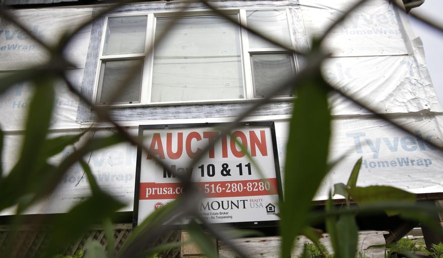 A house damaged by Superstorm Sandy is up for auction in the New Dorp Beach section of Staten Island in New York, Tuesday, May 10, 2016. New York has auctioned off more than 400 wrecked houses that it bought after Superstorm Sandy. The state's goal is to make neighborhoods affected by the 2012 storm stronger and more resilient. The storm caused $65 billion in damage along the Atlantic coast.. (AP Photo/Seth Wenig)