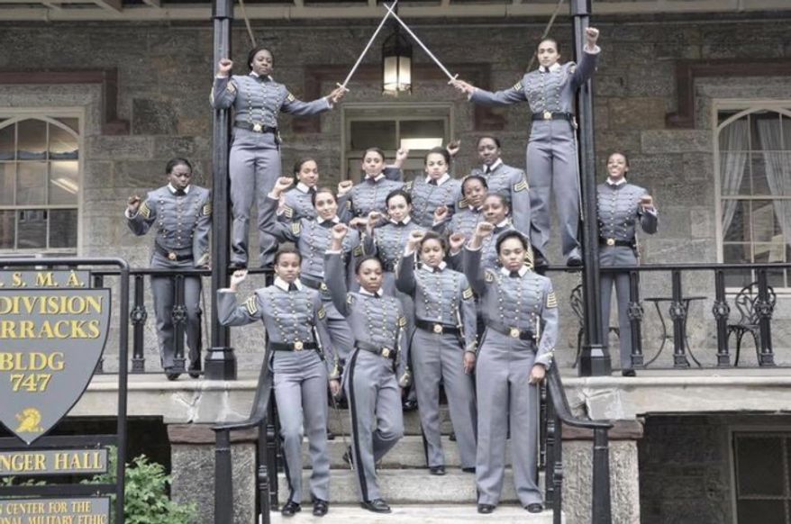 This undated image taken from Twitter shows 16 black, female cadets in uniform with their fists raised while posing for a photograph at the United States Military Academy at West Point, N.Y. ( Photo take from Twitter via AP)