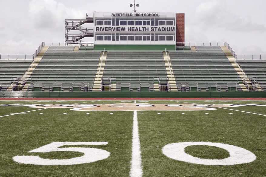 The football stadium at Westfield High School is shown Wednesday, May 11, 2016 in Westfield, Ind. The school, 25 miles north of Indianapolis, agreed in 2014 to a 10-year, $1.2 million naming rights deal with a health care provider, with the money used to help build a 5,000-seat high school football stadium that opened last year.(AP Photo/Michael Conroy)