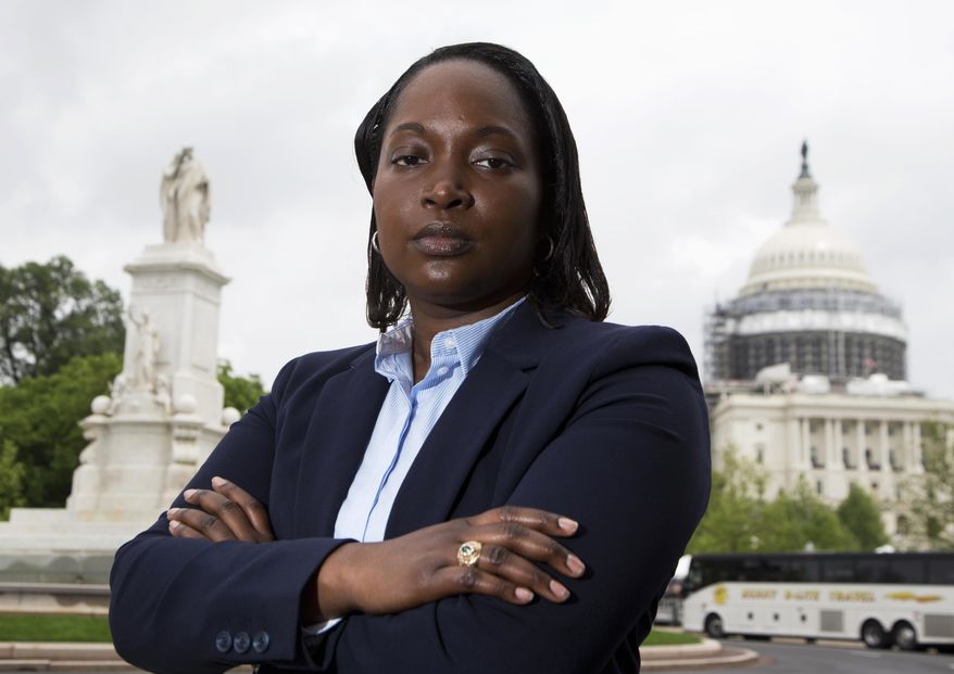 In this photo taken May 13, 2016, Mary Tobin, wearing her West Point class ring, poses for picture in Washington, Friday, May 13, 2016. Self-expression is hardly a part of life for cadets at the United States Military Academy at West Point.Tobin, who has mentored other black women cadets since graduating in 2003, said the experience is one rarely discussed publicly. (AP Photo/Manuel Balce Ceneta)