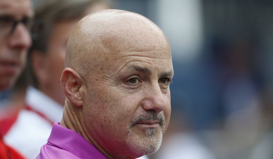 Washington Nationals general manager Mike Rizzo, watches batting practice before a baseball game against the Chicago Cubs at Nationals Park, Friday, June 5, 2015, in Washington. (AP Photo/Alex Brandon)