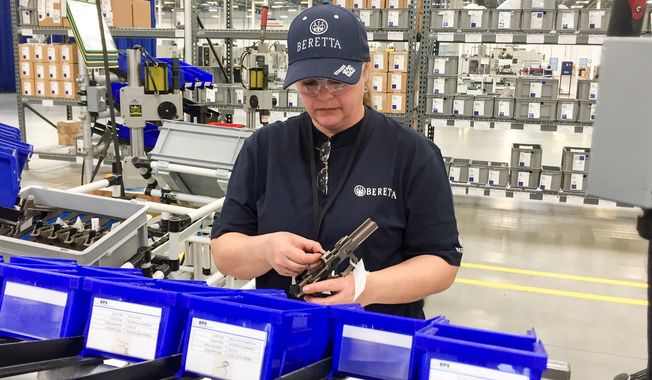 A worker assembles a handgun at the new Beretta plant in Gallatin, Tennessee, on April 15, 2016. The Italian gun maker has cited Tennessee&#x27;s support for gun rights in moving its production from its plant in Maryland. (Associated Press)