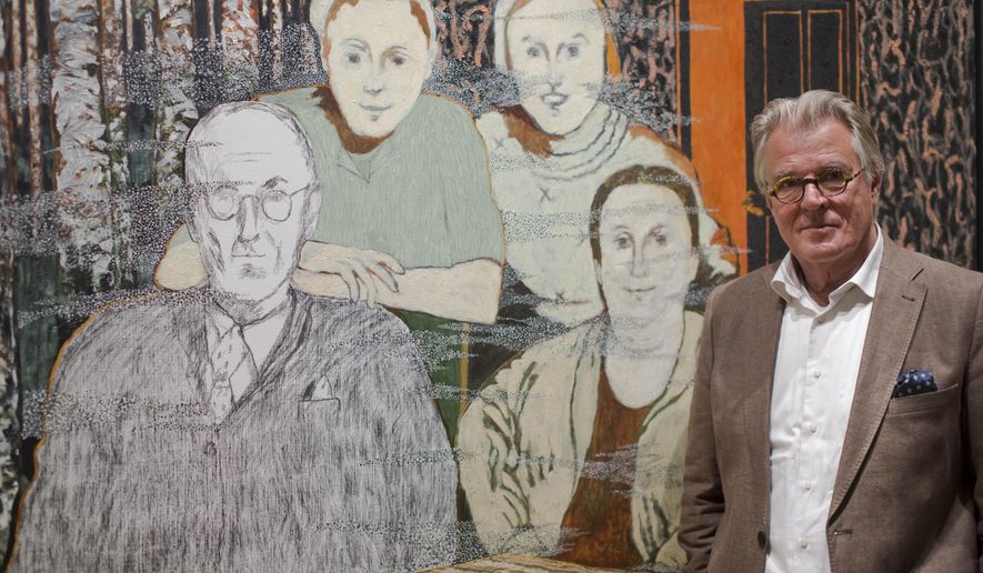 Dutch actor and artist Jeroen Krabbe poses in front of his painting which tells the story of his grandfather Abraham Reiss, left, who was murdered in the Sobibor Nazi German extermination camp, during a press preview at the National Holocaust Museum in Amsterdam, Netherlands, Thursday, May 12, 2016. More than 70 years after tens of thousands of Dutch Jews were deported and murdered by the Nazis, the Netherlands is finally getting a national Holocaust museum. (AP Photo/Peter Dejong)
