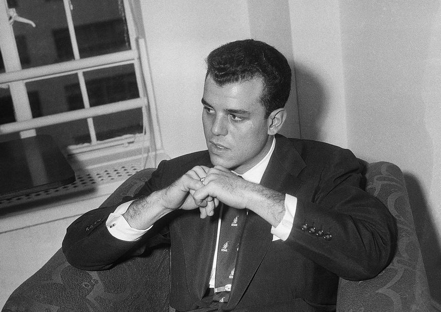 FILE - In this Oct. 26, 1953, file photo, Julius La Rosa, who was fired from the Arthur Godfrey shows, listens to a question during a news conference in Ed Sullivan's apartment in New York. La Rosa, a pop singer known for hits including "Eh, Cumpari," has died at age 86. (AP Photo/John Lindsay, File)