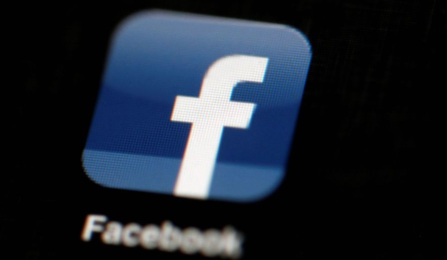 Facebook is under fire for accusations that the site has been manipulating its &quot;trending topics&quot; feature for political bias. (Associated Press) ** FILE **