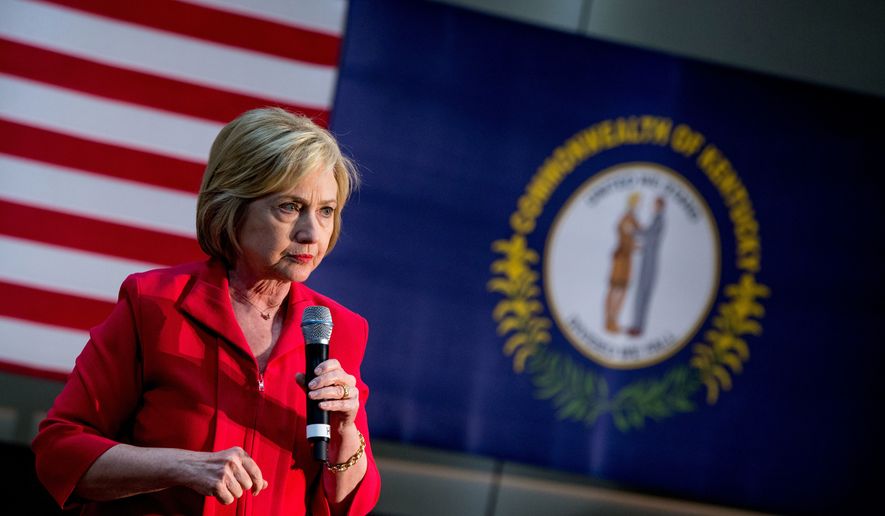 A Kentucky state flag is visible as Democratic presidential candidate Hillary Clinton pauses while speaking at a get out the vote event at James E. Bruce Convention Center in Hopkinsville, Ky., Monday, May 16, 2016. (AP Photo/Andrew Harnik) ** FILE **