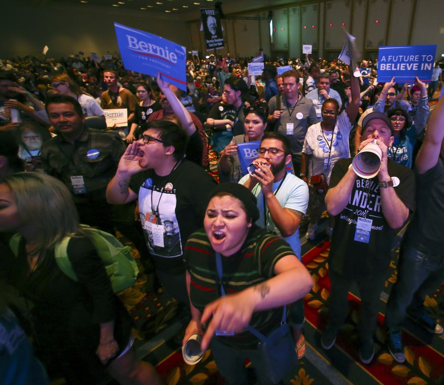 In a Saturday, May 14, 2016 photo, supporters of Democratic presidential candidate Bernie Sanders react as U.S. Sen. Barbara Boxer, D-Calif., speaks during the Nevada State Democratic Party’s 2016 State Convention at the Paris hotel-casino in Las Vegas. The Nevada Democratic Convention turned into an unruly and unpredictable event, after tension with organizers led to some Bernie Sanders supporters throwing chairs and to security clearing the room, organizers said. (Chase Stevens/Las Vegas Review-Journal via AP) LOCAL TELEVISION OUT; LOCAL INTERNET OUT; LAS VEGAS SUN OUT