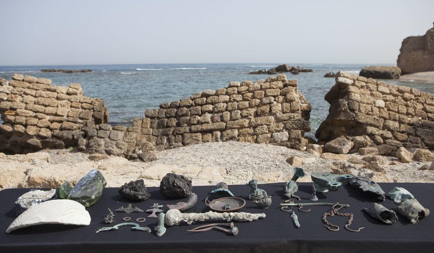 Rare bronze artifacts, part of a large ancient marine cargo of a merchant ship that sank during the Late Roman period 1,600 years ago seen during a presentation of the Israel Antiquities Authority in Caesarea, Israel. Monday, May 16, 2016. Israeli archeologists say two divers have made the country's biggest discovery of Roman-era artifacts in three decades. (AP Photo/Dan Balilty)