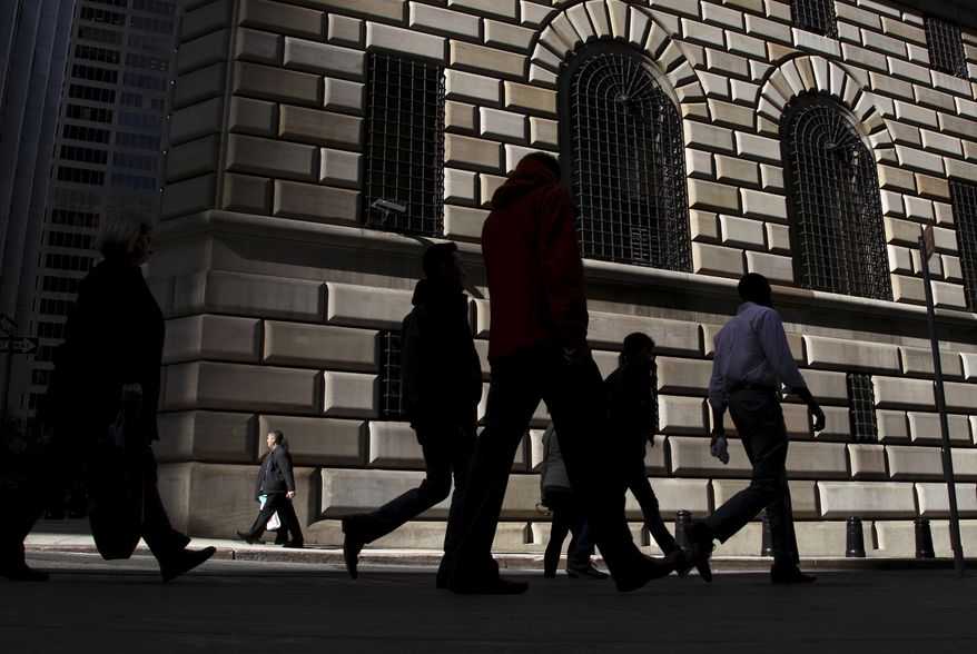 FILE - In this Thursday, Oct. 18, 2012, file photo, pedestrians walk past the Federal Reserve Bank of New York, in New York. On Monday, May 16, 2016, the Federal Reserve Bank of New York reports on factory activity in New York in May as indicated by its Empire State manufacturing index. (AP Photo/Seth Wenig, File)