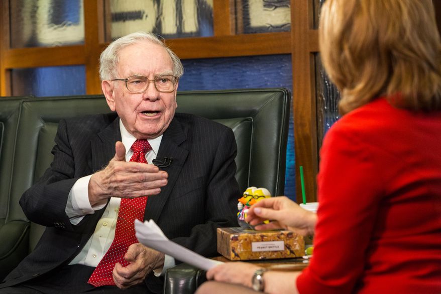 FILE - In this Monday, May 2, 2016, file photo, Berkshire Hathaway Chairman and CEO Warren Buffett speaks during an interview with Liz Claman on the Fox Business Network in Omaha, Neb. On Monday, May 16, 2016, Berkshire revealed that the company bought 9.8 million shares of Apple stock. (AP Photo/John Peterson, File)