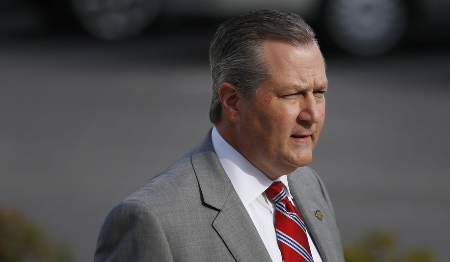 Rep. Mike Hubbard of Auburn, Ala., walks into the Lee County Justice Center during jury selection for the indicted Alabama speaker of the House, Monday, May 16, 2016, in Opelika, Ala. Hubbard is facing 23 felony counts of using his office and past position as chairman of the Alabama GOP for personal gain. (AP Photo/Brynn Anderson)