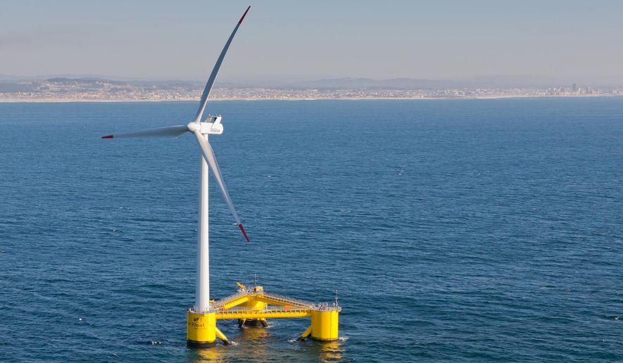 This Nov. 2013, photo provided by Principle Power shows a WindFloat Prototype (WF1) operating at rated power (2MW), 3.1 miles offshore of Aguadoura, Portugal. Massive wind turbines could end up floating in deep ocean waters off Hawaii&#39;s shores under proposals to bring more renewable energy to the islands. Two companies have proposed offshore wind turbine projects for federal waters off Oahu as Hawaii pushes to meet its aggressive renewable energy goals. Hawaii has set a goal for its utilities to use 100 percent renewable energy by the year 2045. (Joshua Weinstein/Principle Power via AP) MANDATORY CREDIT