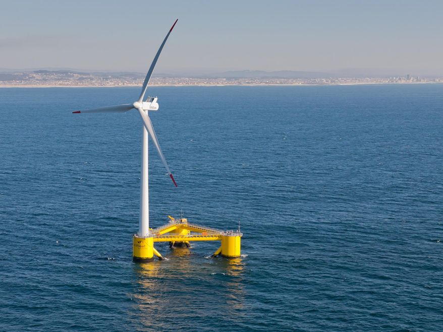 This Nov. 2013, photo provided by Principle Power shows a WindFloat Prototype (WF1) operating at rated power (2MW), 3.1 miles offshore of Aguadoura, Portugal. Massive wind turbines could end up floating in deep ocean waters off Hawaii's shores under proposals to bring more renewable energy to the islands. Two companies have proposed offshore wind turbine projects for federal waters off Oahu as Hawaii pushes to meet its aggressive renewable energy goals. Hawaii has set a goal for its utilities to use 100 percent renewable energy by the year 2045. (Joshua Weinstein/Principle Power via AP) MANDATORY CREDIT