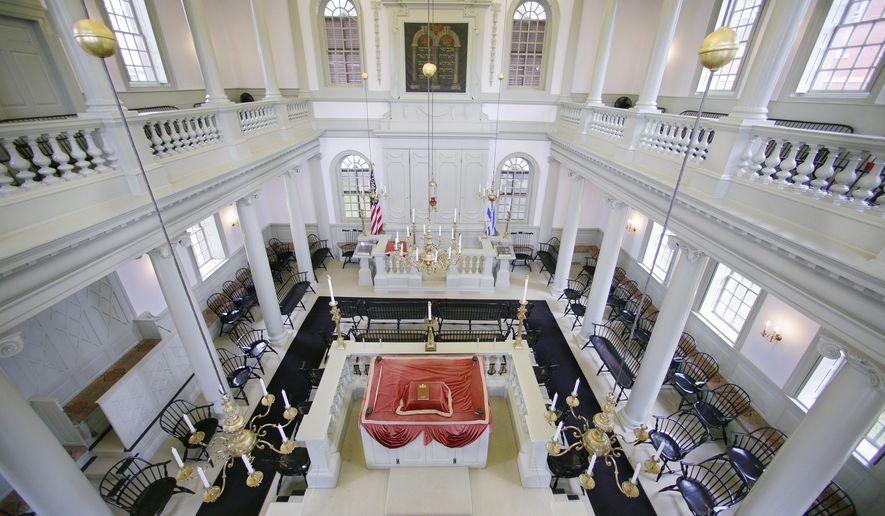 FILE - In this Thursday, May 28, 2015 file photo, an interior view of the Touro Synagogue, the nation's oldest, is seen from the "ladies gallery" in Newport, R.I. A federal judge on Monday, May 16, 2016, awarded control of Touro and a pair of ceremonial bells valued at more than $7 million to the congregation that worships there. A lawsuit pitted the congregants against the nation's oldest Jewish congregation in New York City which became trustee of Touro in the 1820s after Jews left, Newport. (AP Photo/Stephan Savoia, File)