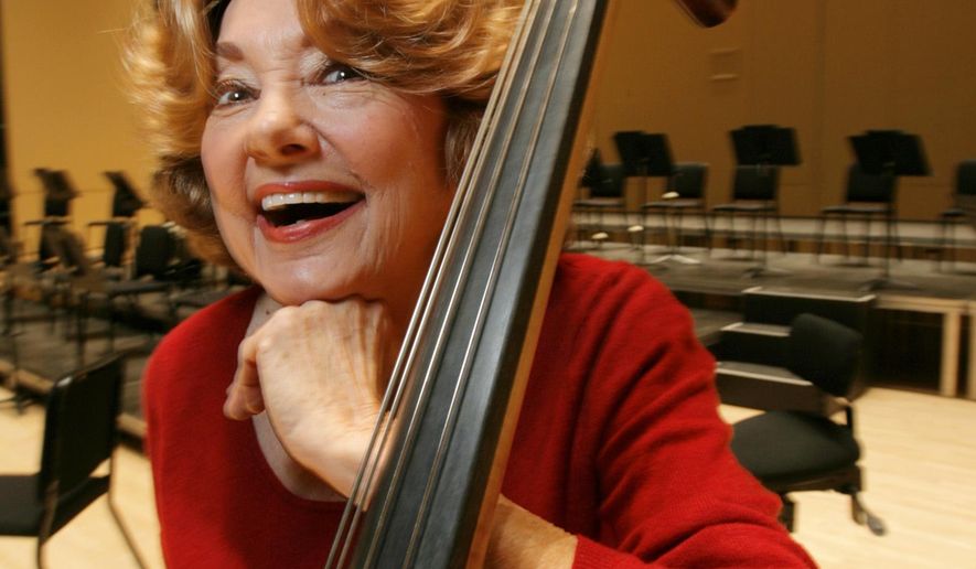 In this Nov. 15, 2007 photo, Jane Little, an Atlanta Symphony Orchestra bassist, poses for a photo in Atlanta. Little, whose career spanned a world-record with a single orchestra, has died at age 87 after collapsing onstage Sunday, May 15, 2016, during a performance. (Louie Favorite/Atlanta Journal-Constitution via AP) MARIETTA DAILY OUT; GWINNETT DAILY POST OUT; LOCAL TELEVISION OUT; WXIA-TV OUT; WGCL-TV OUT; MANDATORY CREDIT