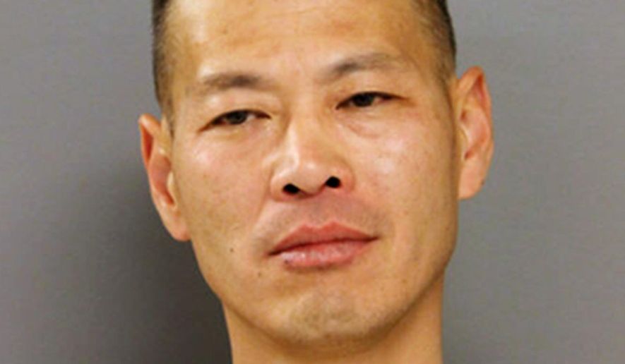 This photo provided by the Chicago Police Department shows Hong Chu of Chicago, who was arrested Sunday, May 15, 2016, and charged with impersonating a police officer. Chu has twice been convicted of falsely impersonating a police officer and was on probation for his second offense when he was arrested. (Chicago Police Department via AP)