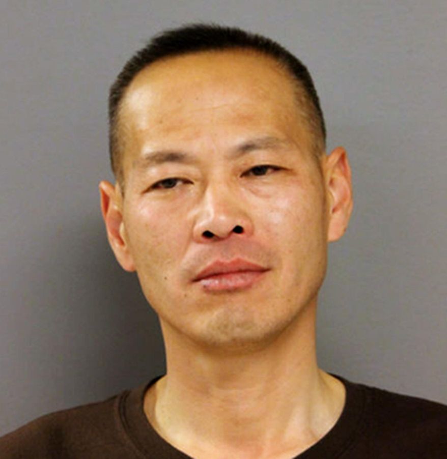 This photo provided by the Chicago Police Department shows Hong Chu of Chicago, who was arrested Sunday, May 15, 2016, and charged with impersonating a police officer. Chu has twice been convicted of falsely impersonating a police officer and was on probation for his second offense when he was arrested. (Chicago Police Department via AP)
