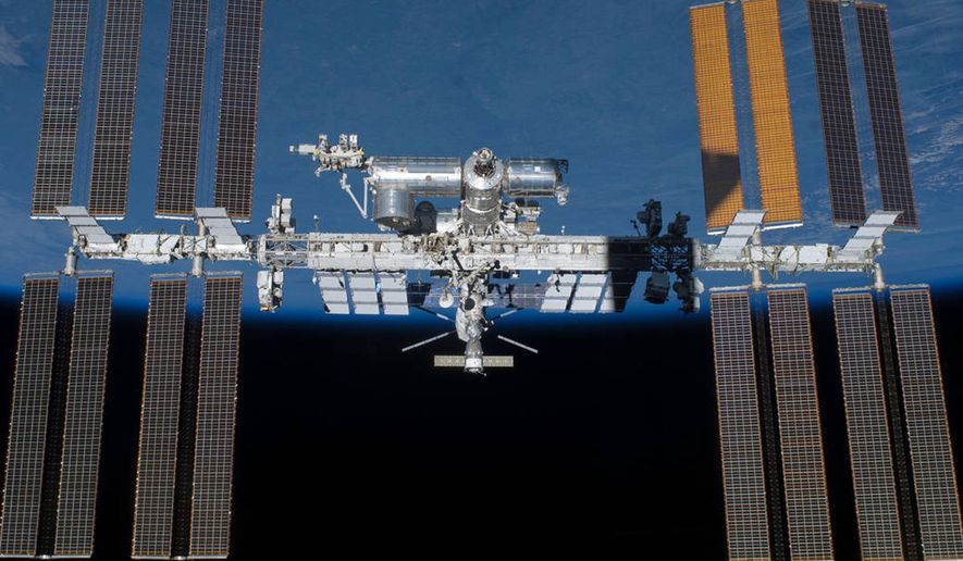 An undated photo provided by NASA shows the International Space Station in orbit. On Monday, May 16, 2016, the International Space Station made its 100,000th orbit circling of the world. NASA says these 100,000 orbits are akin to traveling more than 2.6 billion miles. (NASA via AP)