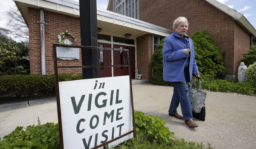 Margaret O'Brien, a parishioner at the church of St. Frances X. Cabrini, departs the church Monday, May 16, 2016, in Scituate, Mass. The Supreme Court has refused to hear an appeal from parishioners who are occupying the church, which the Roman Catholic Archdiocese of Boston closed more than a decade ago. (AP Photo/Steven Senne)