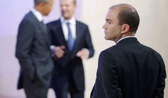 Deputy National Security Adviser for strategic communications Ben Rhodes stands at right as President Obama and Polish Prime Minister Donald Tusk leave the stage after making statements to reporters in Warsaw on June 3, 2014. (Associated Press) **FILE**