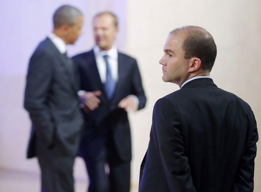 Deputy National Security Adviser for strategic communications Ben Rhodes stands at right as President Obama and Polish Prime Minister Donald Tusk leave the stage after making statements to reporters in Warsaw on June 3, 2014. (Associated Press) **FILE**
