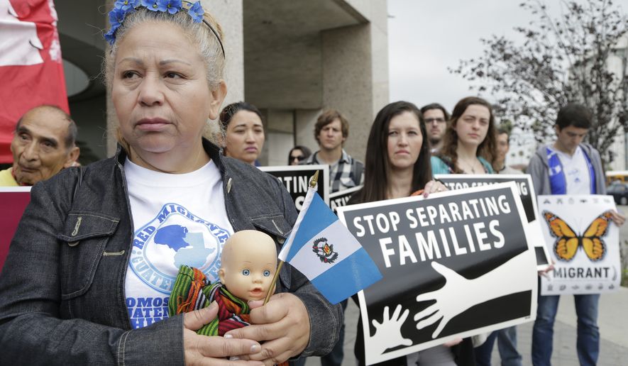 Guatemalan immigrant Amariliz Ortiz holds a doll as she joins families impacted by the immigration raids during a rally with Members of the Coalition for Humane Immigrant Rights of Los Angeles, CHIRLA, outside the ICE Metropolitan Detention Center in downtown Los Angeles on May 17, 2016. Families rally to call on the Obama administration to grant Temporary Protected Status, TPS, to Central American women and children seeking refuge in the U.S. (Associated Press) **FILE**