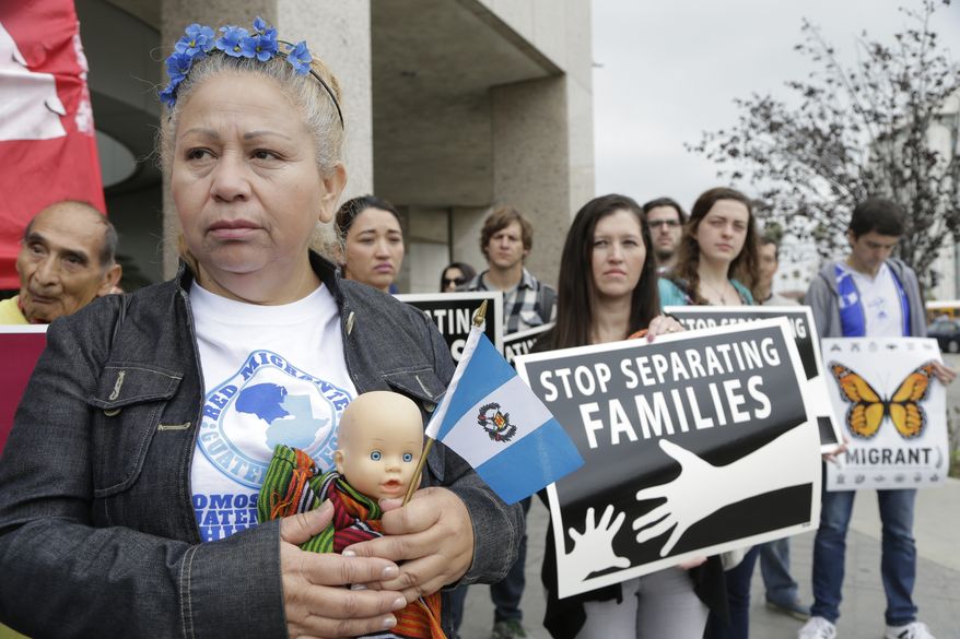 Guatemalan immigrant Amariliz Ortiz holds a doll as she joins families impacted by the immigration raids during a rally with Members of the Coalition for Humane Immigrant Rights of Los Angeles, CHIRLA, outside the ICE Metropolitan Detention Center in downtown Los Angeles on May 17, 2016. Families rally to call on the Obama administration to grant Temporary Protected Status, TPS, to Central American women and children seeking refuge in the U.S. (Associated Press) **FILE**