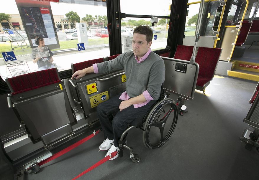 In this Monday, May 16, 2016 photo, Boone Blocker, who has to use an alternative form of transportation like Capital Metro to get around town now that Uber and Lyft have left, waits on a MetroRapid bus near Northcross Mall for a trip to City Hall in downtown Austin, Texas. (Ralph Barrera /Austin American-Statesman via AP) AUSTIN CHRONICLE OUT, COMMUNITY IMPACT OUT, INTERNET AND TV MUST CREDIT PHOTOGRAPHER AND STATESMAN.COM, MAGS OUT; MANDATORY CREDIT