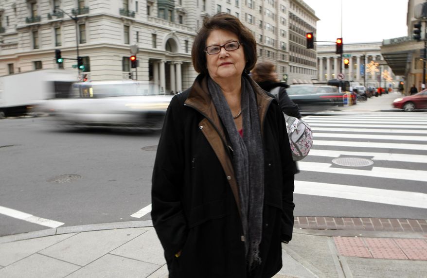 FILE - This Tuesday, Dec. 8, 2009 picture shows Elouise Cobell outside the law offices of Kilpatrick & Stockton in Washington. U.S. officials are adding 63 American Indian reservations across the Midwest and West to an initiative that seeks to return millions of acres of land to tribal ownership. it's the result of a legal settlement with American Indians led by Cobell of Montana, who said the U.S. mismanaged trust money held on behalf of hundreds of thousands of Indians. (AP Photo/Gerald Herbert,File)
