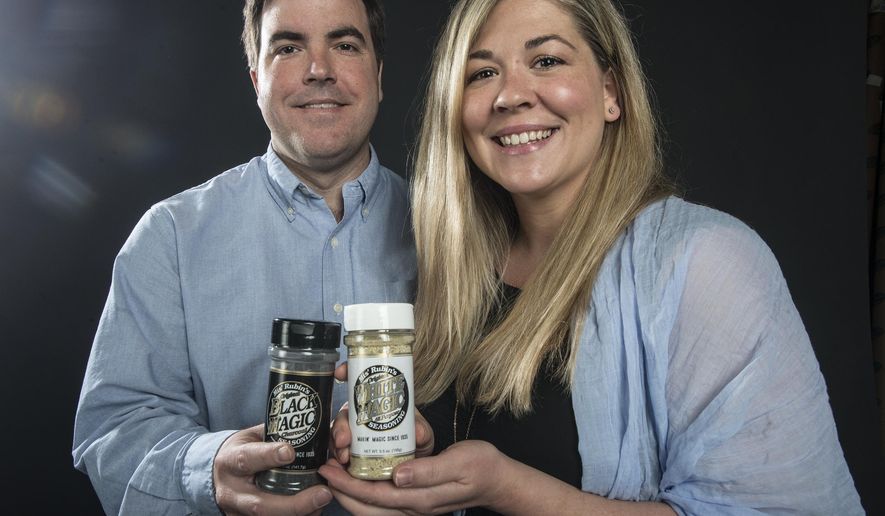 In this photo taken Tuesday May 10, 2016, Robert and Ashley Landers pose for a photo in Montgomery, Ala. For years, the only way to get a savory rub called "Black Magic" was to purchase it on a steak from a butcher shop called Penny Profit. The Landers are now marketing the rub thought a website and in locations that include the gift shops in Alabama's Capitol and Governor's Mansion.. (Shannon Heupel/The Montgomery Advertiser via AP) NO SALES; MANDATORY CREDIT