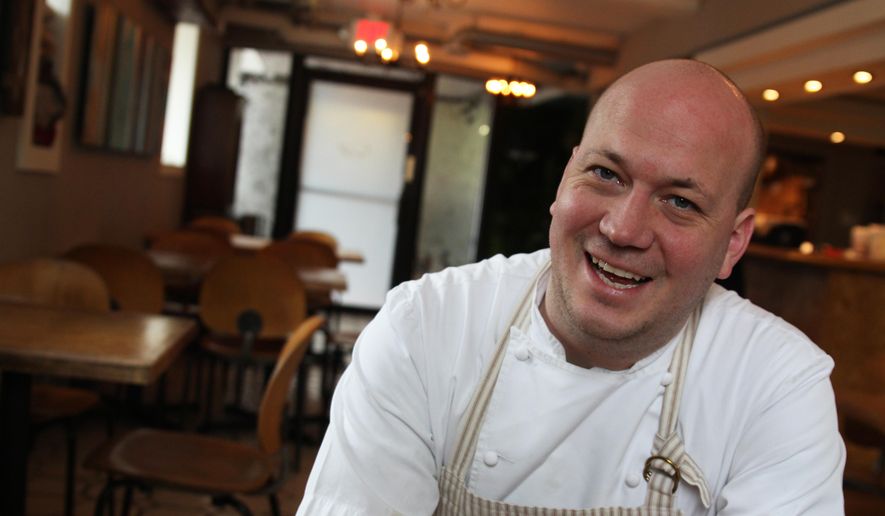 In this photo taken May 4, 2016 chef Justin Carlisle sits in the dining room of his restaurant, Ardent, in Milwaukee. This year, Carlisle made it to the final round of the James Beard Awards, considered the Oscars of the food world. He was also a semi-finalist in the best new restaurant category in 2014 and made it to the finals in 2015. (AP Photo/Carrie Antlfinger)