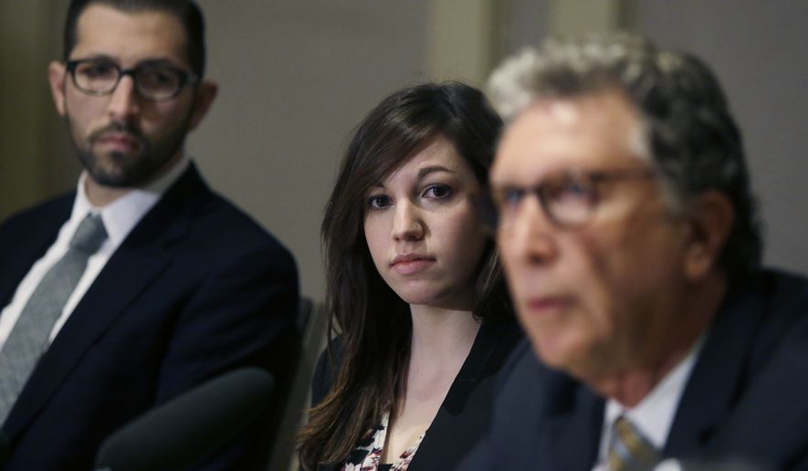 Alyssa Leader, a recent Harvard graduate, listens while flanked by her attorneys Alex Zalkin, left, and Irwin Zalkin at a news conference, Wednesday, Feb. 17, 2016, in Cambridge, Mass., about the filing of a Title IX civil lawsuit on her behalf alleging the university failed to adequately protect her and investigate complaints of sexual assault, harassment and retaliation. Leader says she was sexually assaulted between March 2013 and March 2014 on campus while she was a student at Harvard. (AP Photo/Elise Amendola)