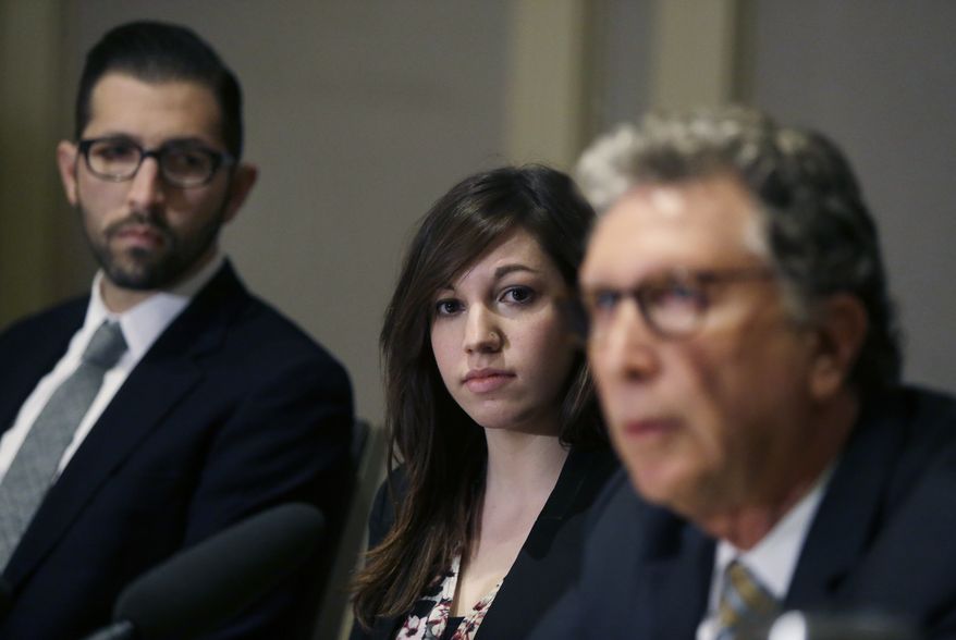 Alyssa Leader, a recent Harvard graduate, listens while flanked by her attorneys Alex Zalkin, left, and Irwin Zalkin at a news conference, Wednesday, Feb. 17, 2016, in Cambridge, Mass., about the filing of a Title IX civil lawsuit on her behalf alleging the university failed to adequately protect her and investigate complaints of sexual assault, harassment and retaliation. Leader says she was sexually assaulted between March 2013 and March 2014 on campus while she was a student at Harvard. (AP Photo/Elise Amendola)