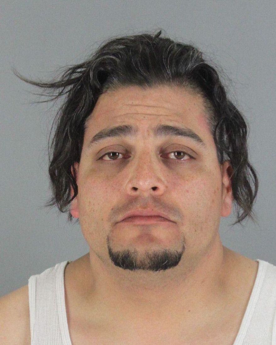 This booking photo provided by San Mateo County Sheriff's Office shows Juan Zarate. Zarate, a PetSmart dog groomer will be arraigned next month on a felony animal cruelty charge after police say he likely contributed to the death of a dachshund in his care. Police in San Mateo, Calif., say Zarate was about three minutes into a grooming session Sunday, May 15, 2016, when he brought the dachshund to its owner with a bleeding mouth and trouble breathing. An on-site veterinarian wasn't able to save the dog. An X-ray revealed two broken ribs and a punctured lung. (San Mateo County Sheriff's Office via AP)