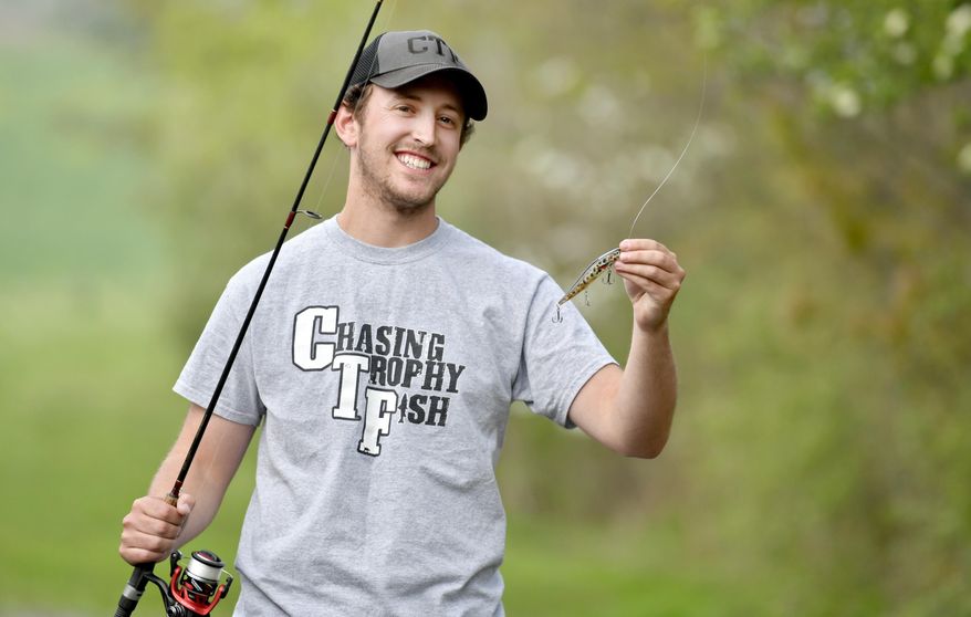In a May 11, 2016 photo, Vaughn Holderman shows one of his shade lures he has created, in State College, Pa. About three years ago, as a Penn State junior, Holderman didn't expect to sell his wares on the mass market, let alone to places as far away as Europe. But now Holderman, 23, has caught the eye of much bigger fish with his glittering, lifelike lures. (Abby Drey/Centre Daily Times via AP) MANDATORY CREDIT; MAGS OUT