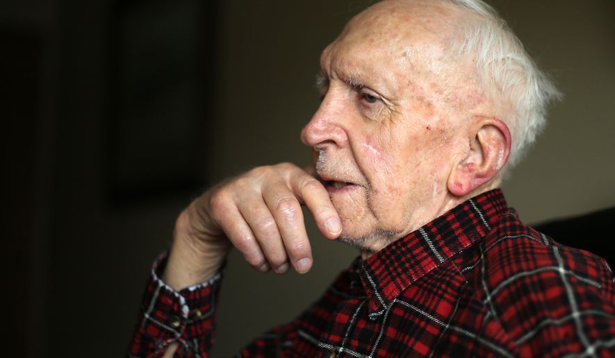 In this photo taken Monday, May 9, 2016, Chuck Kline, 93, reflects on his experiences in a U.S. Navy submarine during World War II during an interview at Primrose Retirement Community in Cheyenne, Wyo. (Blaine McCartney/The Wyoming Tribune Eagle via AP) MANDATORY CREDIT