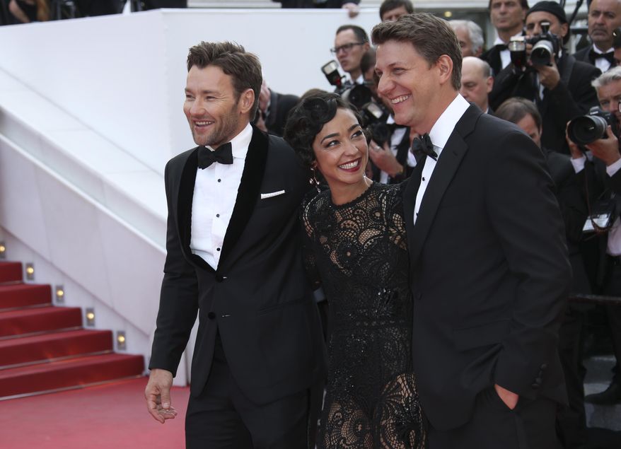 Actor Joel Edgerton, actress Ruth Negga, and director Jeff Nichols, from left, pose for photographers upon arrival at the screening of the film Loving at the 69th international film festival, Cannes, southern France, Monday, May 16, 2016.(AP Photo/Joel Ryan)