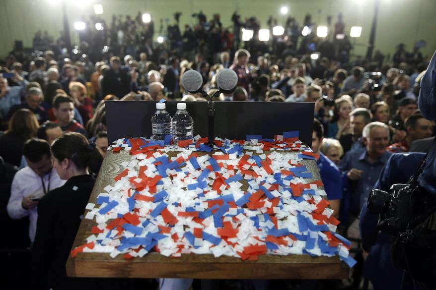 FILE - In this March 15, 2016, file photo, confetti covers a podium after Ohio Gov. John Kasich, winner of the state's Republican presidential primary, spoke at his primary election night rally in Berea, Ohio. In the swing state of Ohio, more than three times as many Democrats cast Republican ballots in the March 15, 2016, presidential primary compared with the number of GOP party switchers, according to data released Wednesday, May 18, 2016, by Ohio Secretary of State Jon Husted's office. (AP Photo/Matt Rourke, File)