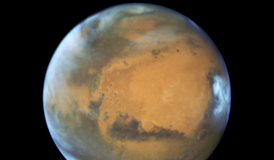 This May 12, 2016, file image provided by NASA shows the planet Mars. (NASA/ESA/Hubble Heritage Team - STScI/AURA, J. Bell - ASU, M. Wolff - Space Science Institute via AP)