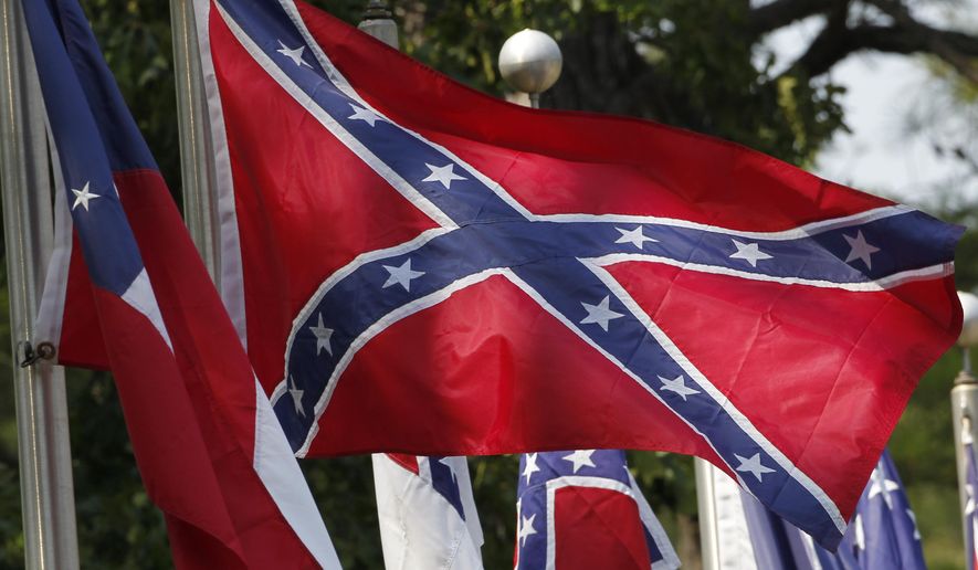 In this July 19, 2011, file photo, Confederate battle flags fly in Mountain Creek, Ala. (AP Photo/Dave Martin, File)