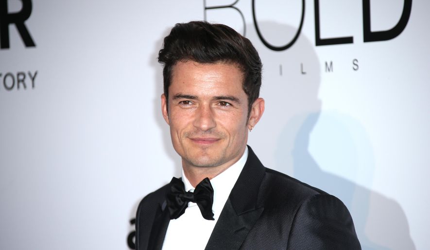 Actor Orlando Bloom poses for photographers upon arrival at the amfAR Cinema Against AIDS benefit at the Hotel du Cap-Eden-Roc, during the 69th Cannes international film festival, Cap d'Antibes, southern France, Thursday, May 19, 2016. (AP Photo/Joel Ryan)