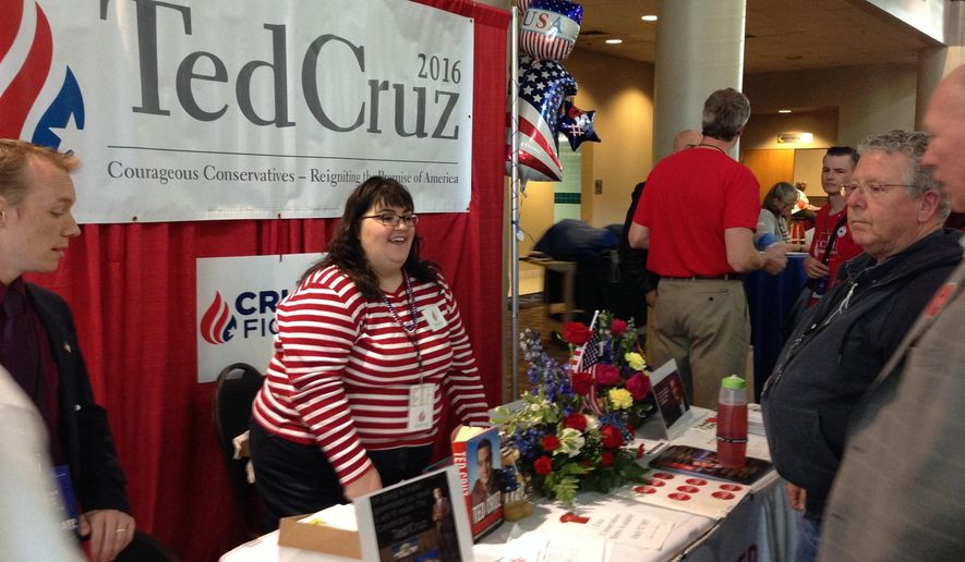 Jennifer Fetters of Bellevue, Wash., works the Ted Cruz booth at the Washington state GOP convention in Pasco, Wash., Thursday, May 19, 2016. More than 2,000 Republicans from across Washington are expected to attend the convention, which runs through Saturday. (AP Photo/Nicholas K. Geranios)